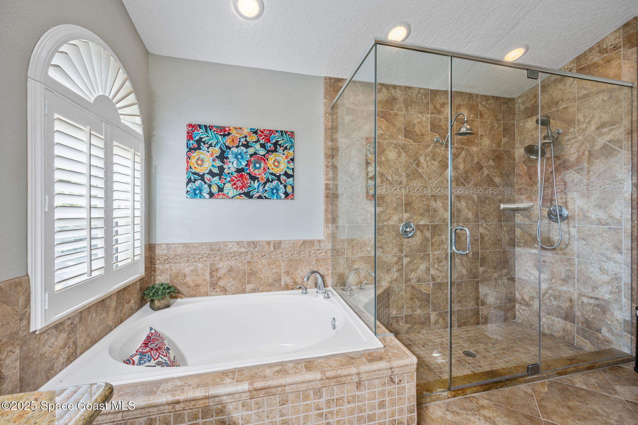 4385 Windover Way Melbourne, FL 32934 - Photo 29 of 44 a bathroom with a bathtub and a shower