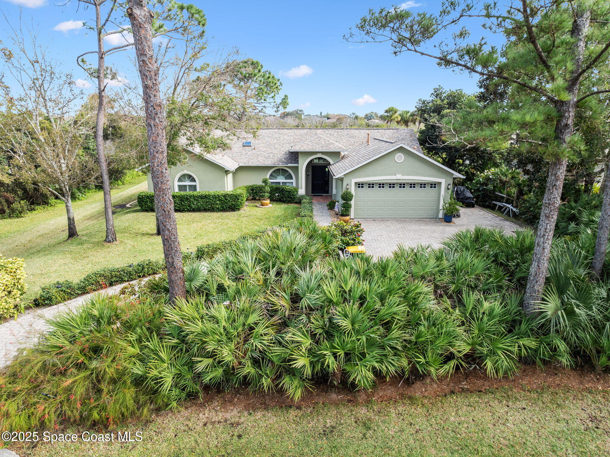 4385 Windover Way Melbourne, FL 32934 - Photo 7 of 44 a view of a garden with large trees