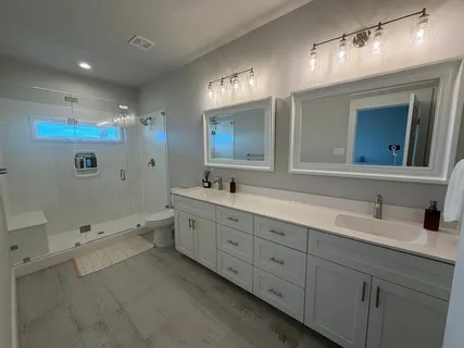 a bathroom with a bathtub and a shower