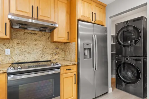 a view of a kitchen with washer and dryer