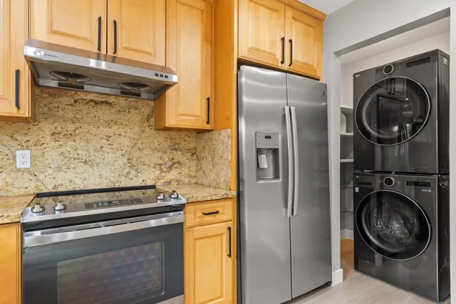 a view of a kitchen with washer and dryer