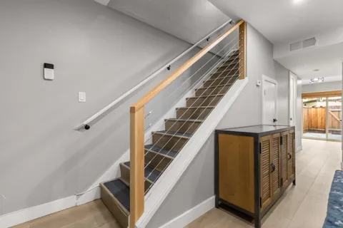 a view of a hallway with staircase