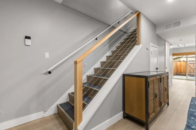 a view of a hallway with staircase