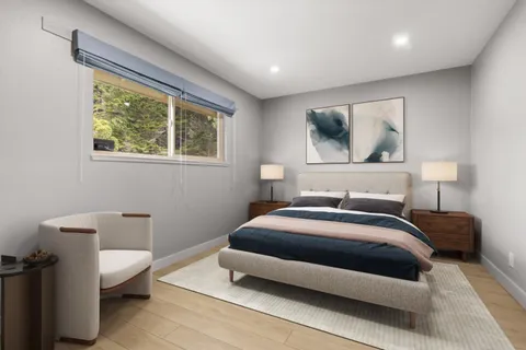 a bedroom with a bed and window