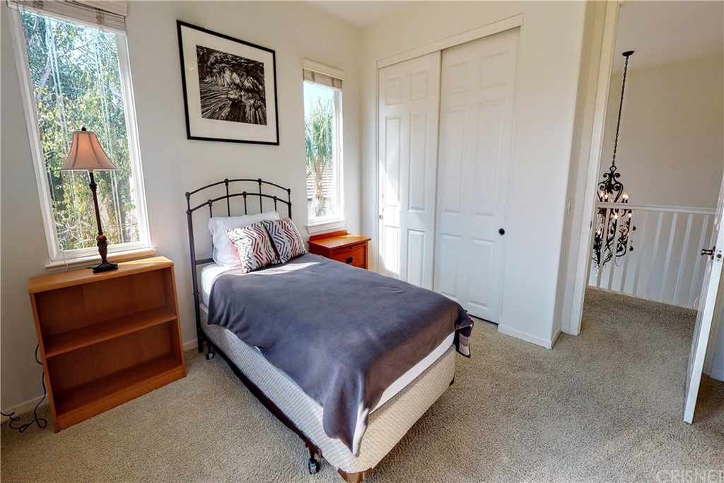 953 Clear Sky Place Simi Valley, CA 93065 - Photo 22 of 53 a bedroom with a bed lamp and window