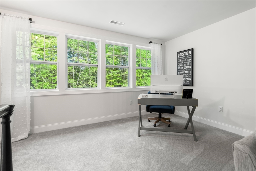 2 Hummingbird Way, Unit 1 Methuen, MA 01844 - Photo 25 of 42 a view of a workspace with a window