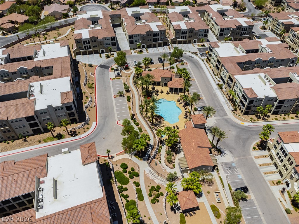 2555 Hampton Road, Unit 3308 Henderson, NV 89052 - Photo 59 of 65 An aerial perspective reveals a vibrant community with a central pool and neatly integrated landscaping.