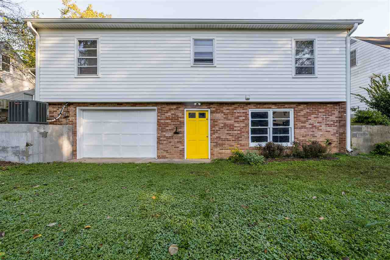 714 New Road Raleigh, NC 27608 - Photo 25 of 25 Garage door opens to basement for a large space to play and bring the indoors outdoors! Back Exterior
