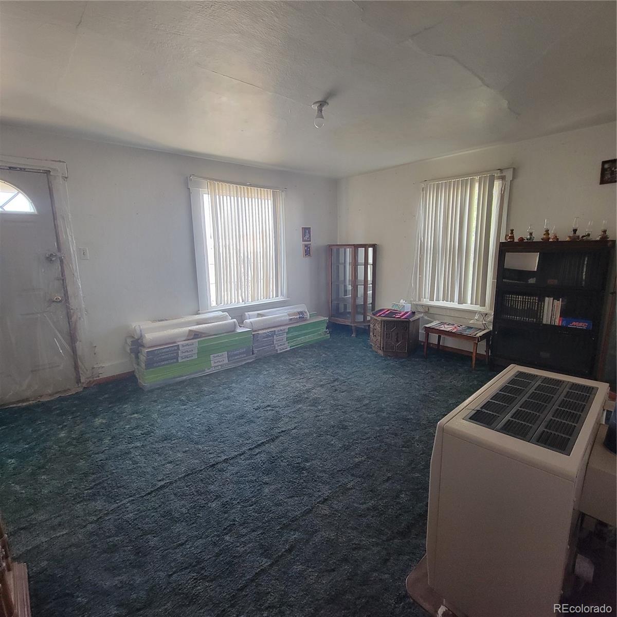 8600 Madison Street Hooper, CO 81136 - Photo 9 of 11 a room with window and lounge chair