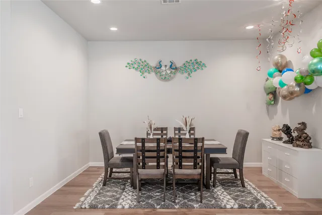 a view of a dining room with furniture