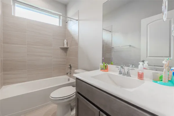 a bathroom with a sink a toilet and a bathtub