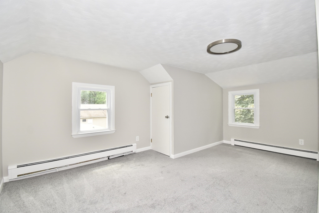 94 David Street Springfield, MA 01104 - Photo 13 of 39 an empty room with a empty space and windows