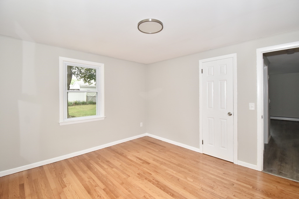 94 David Street Springfield, MA 01104 - Photo 27 of 39 a view of a room with wooden floor and window