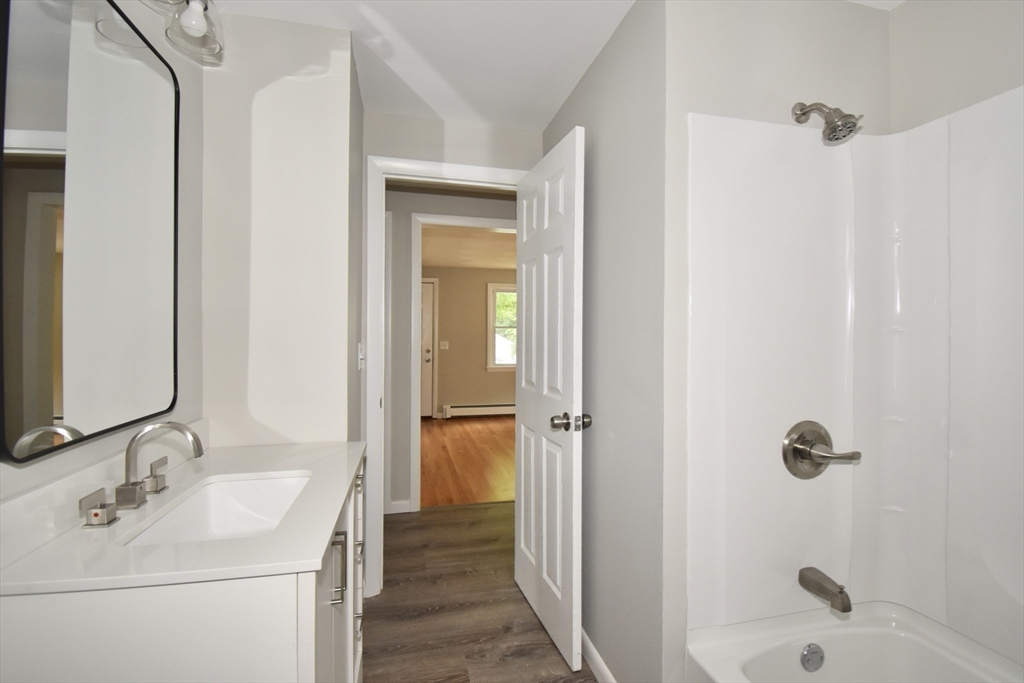94 David Street Springfield, MA 01104 - Photo 30 of 39 a bathroom with a sink a toilet and shower
