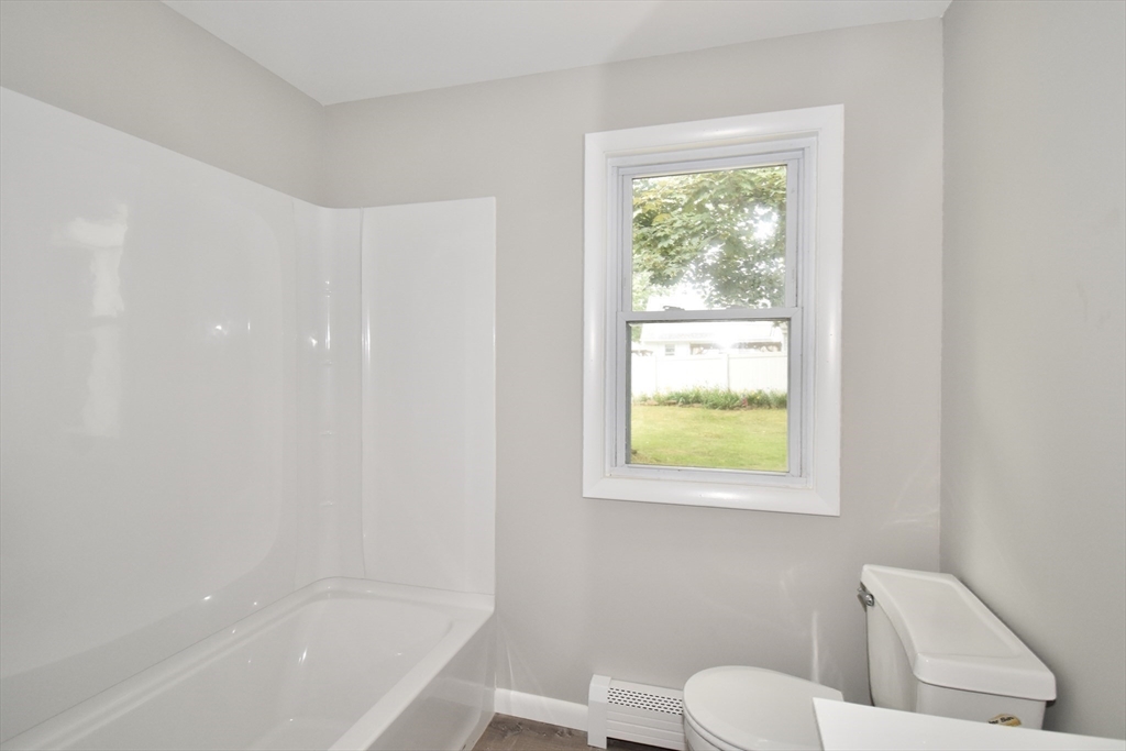 94 David Street Springfield, MA 01104 - Photo 31 of 39 a bathroom with a toilet a sink and a bathtub