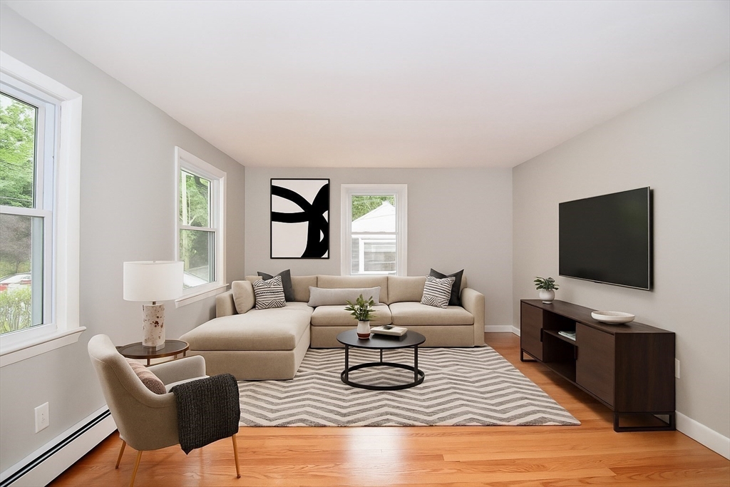 94 David Street Springfield, MA 01104 - Photo 4 of 39 a living room with furniture and a flat screen tv