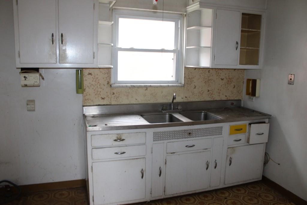 825 Liberty Street Duquesne, PA 15110 - Photo 9 of 25 a utility room with cabinets washer and dryer