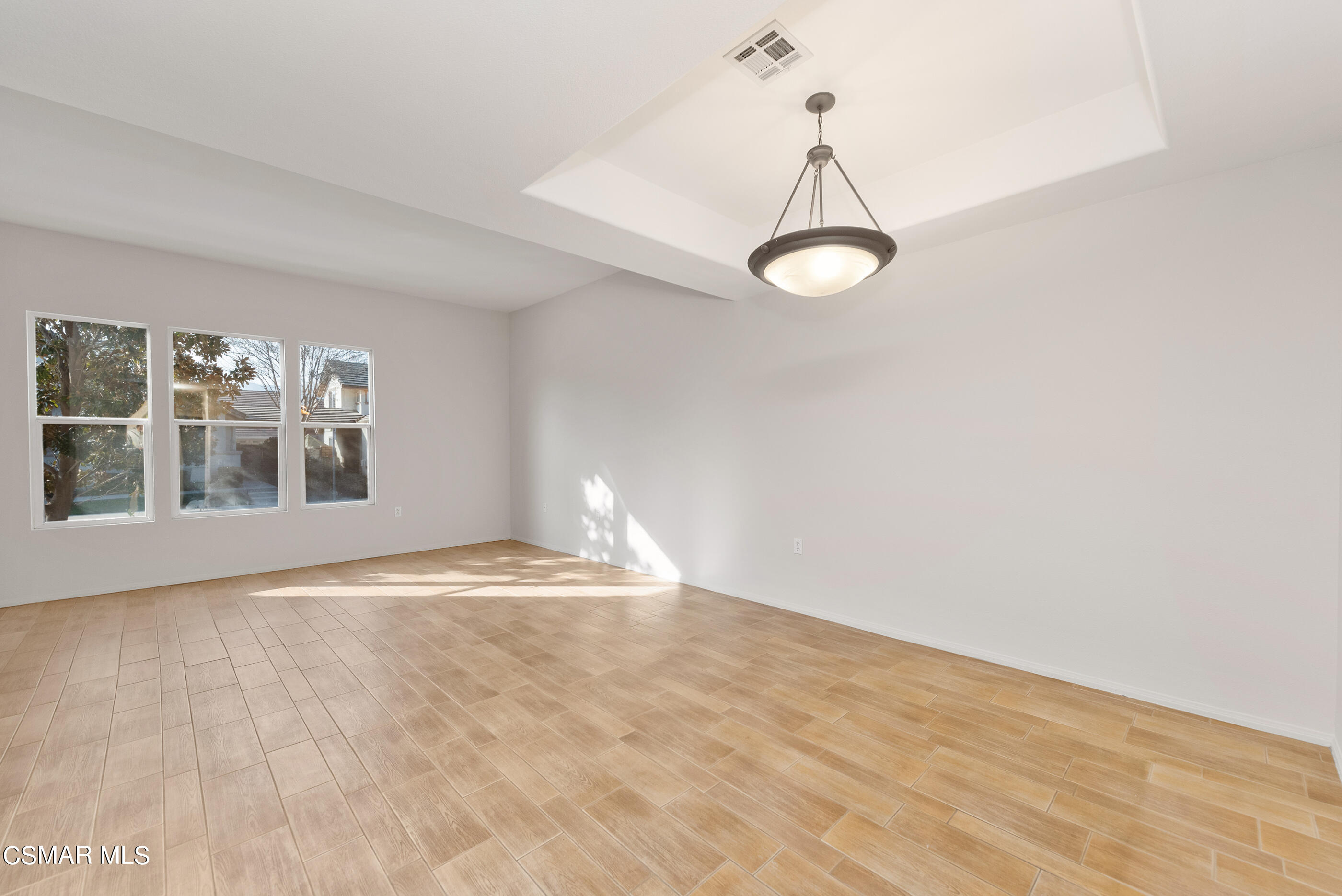 5641 Daisy Street Simi Valley, CA 93063 - Photo 13 of 49 a view of empty room with wooden floor and windows