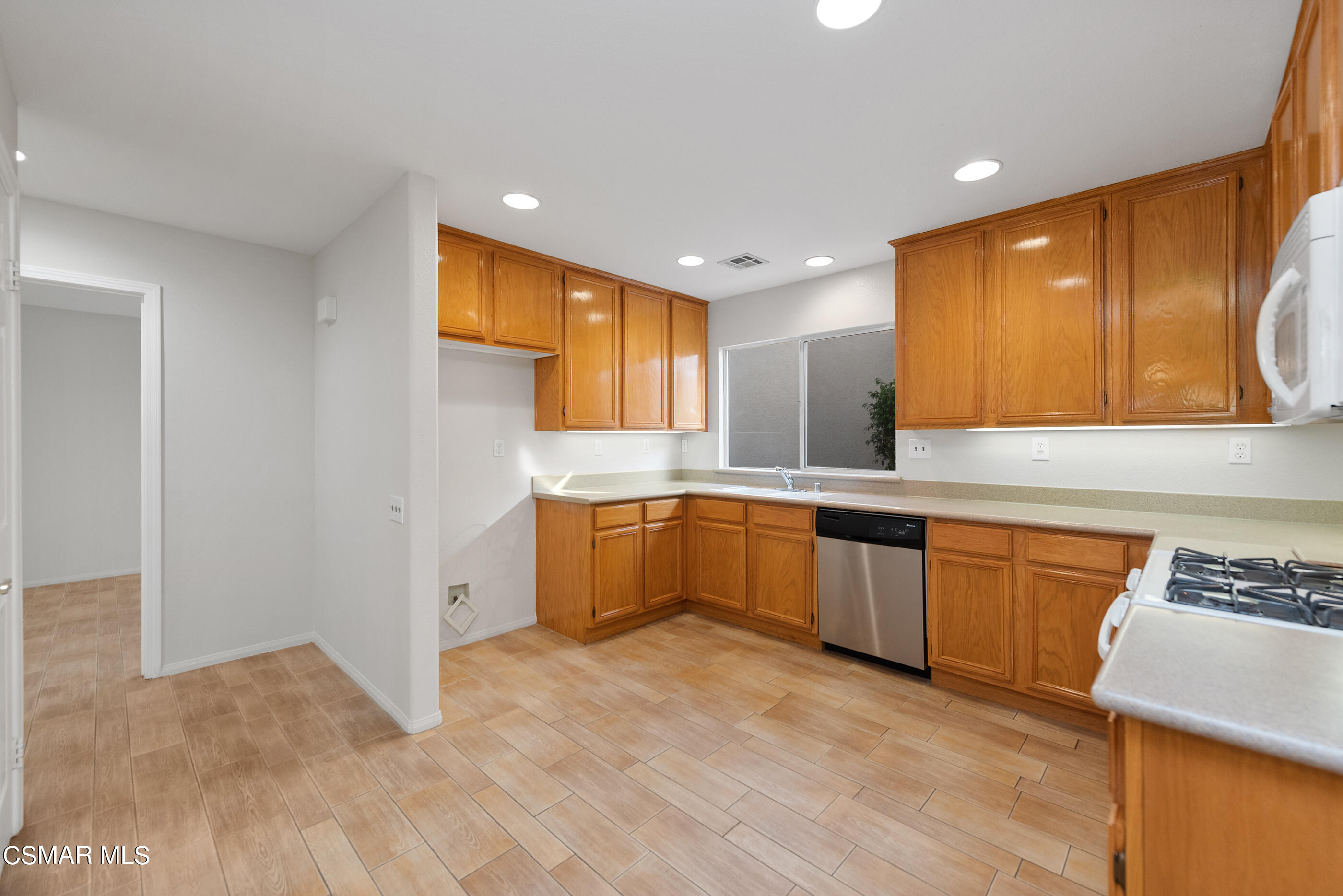5641 Daisy Street Simi Valley, CA 93063 - Photo 14 of 49 a large kitchen with a sink and cabinets