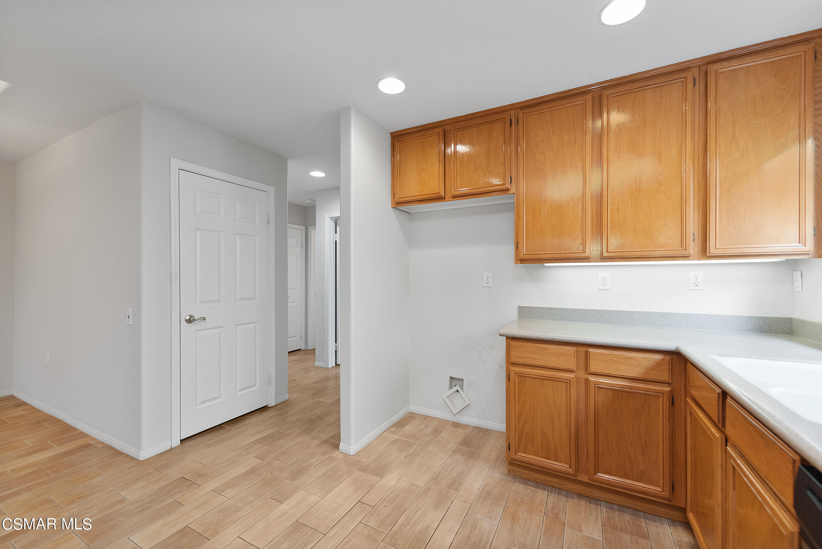 5641 Daisy Street Simi Valley, CA 93063 - Photo 18 of 49 a view of a kitchen with wooden floor
