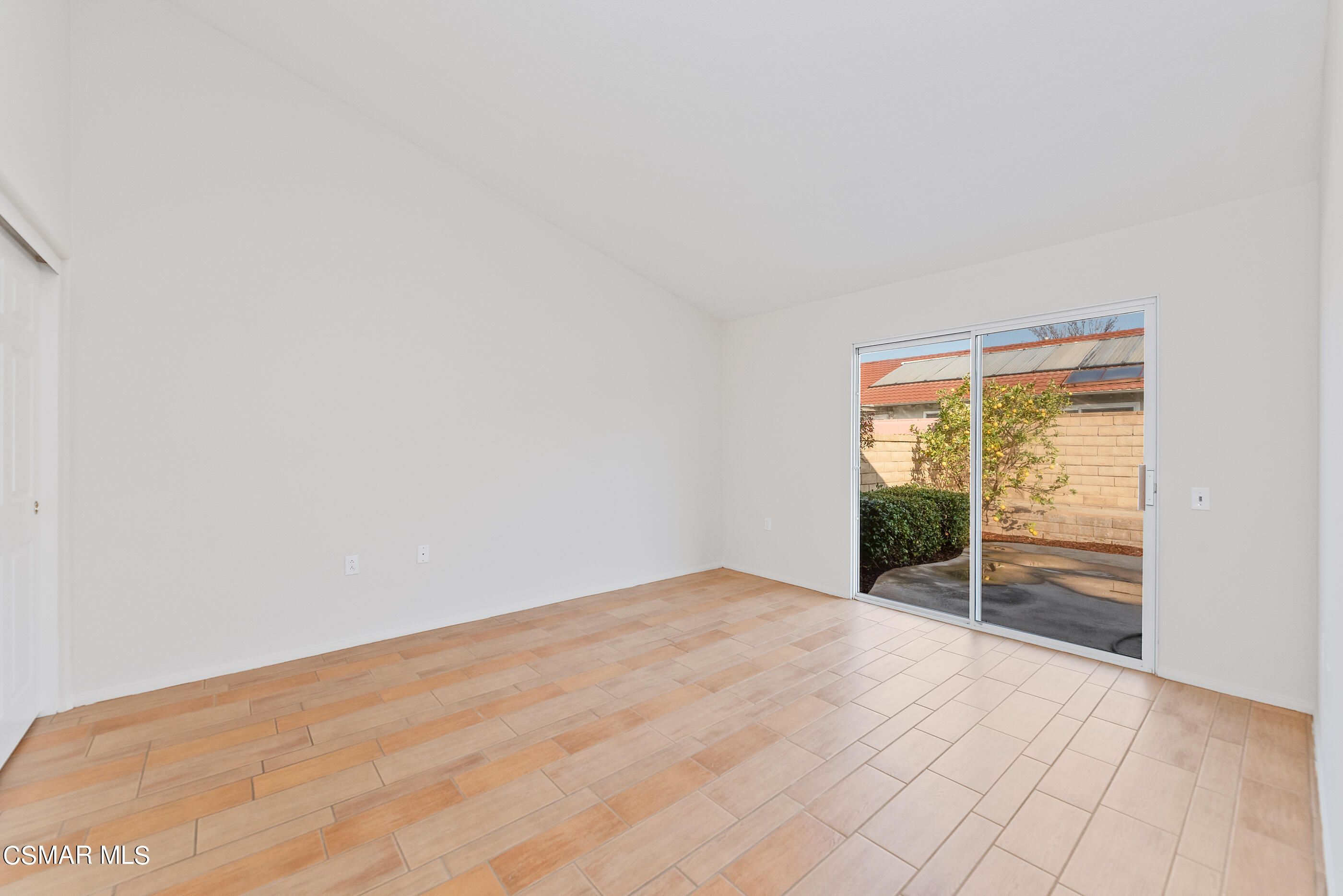 5641 Daisy Street Simi Valley, CA 93063 - Photo 25 of 49 a view of an empty room with wooden floor and a window