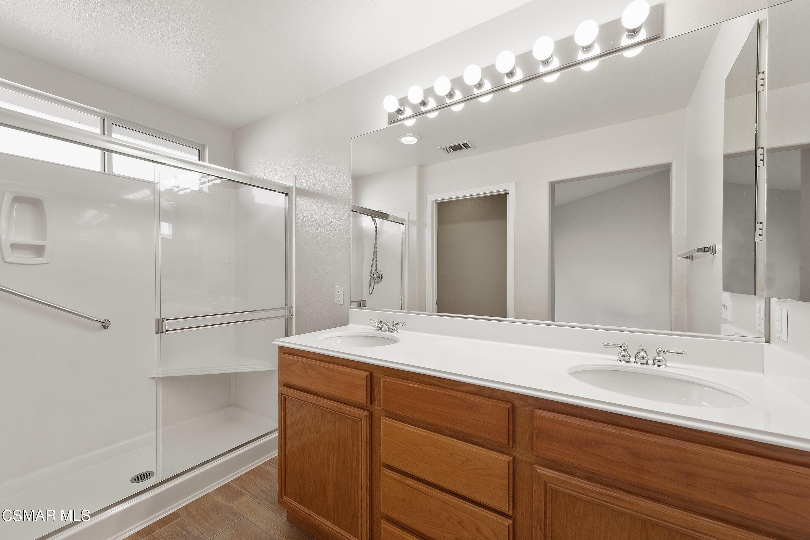 5641 Daisy Street Simi Valley, CA 93063 - Photo 28 of 49 a bathroom with a sink double vanity and a mirror