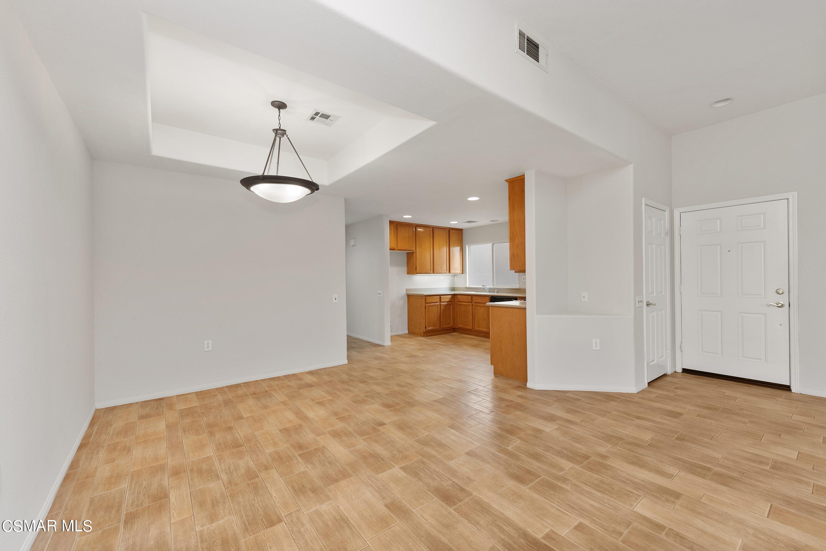 5641 Daisy Street Simi Valley, CA 93063 - Photo 8 of 49 a view of a kitchen with a dishwasher and a refrigerator