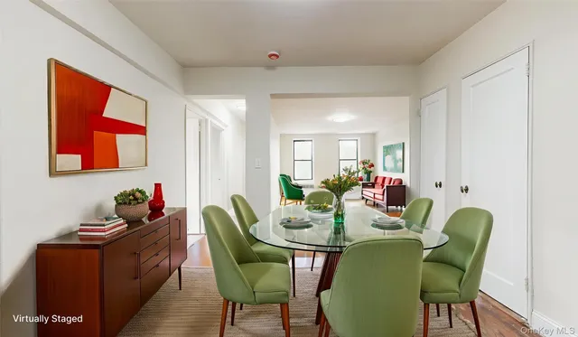 a dining room with furniture and window