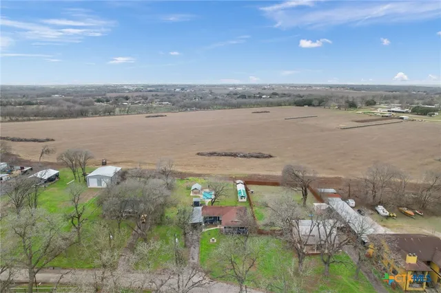 an aerial view of a houses with outdoor space