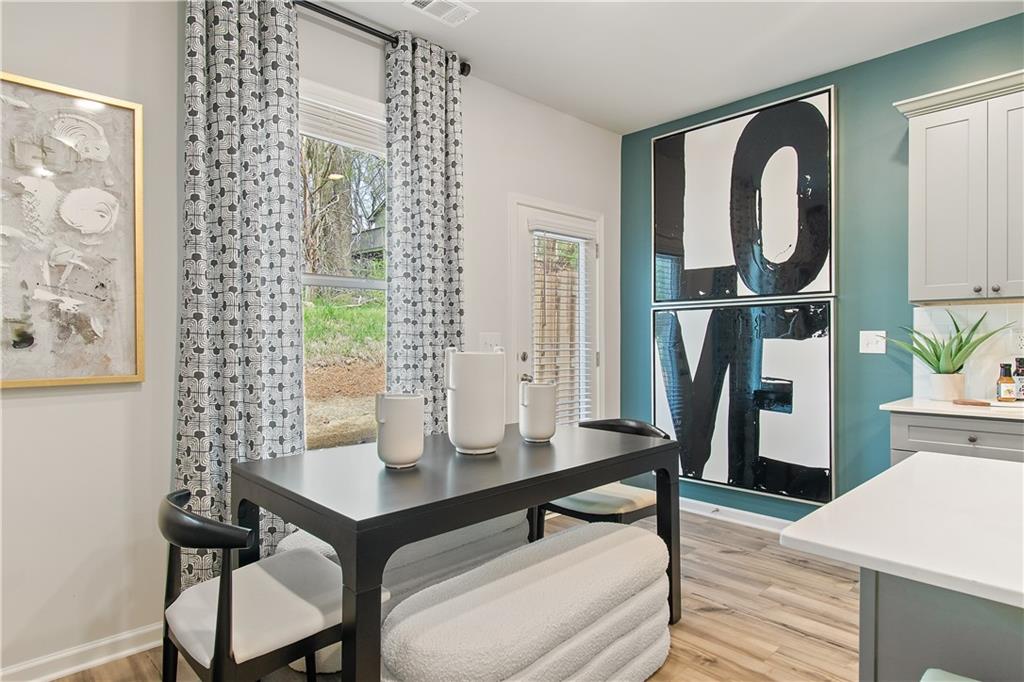 631 Treasure Drive Stockbridge, GA 30281 - Photo 12 of 33 a view of a workspace room with furniture and wooden floor