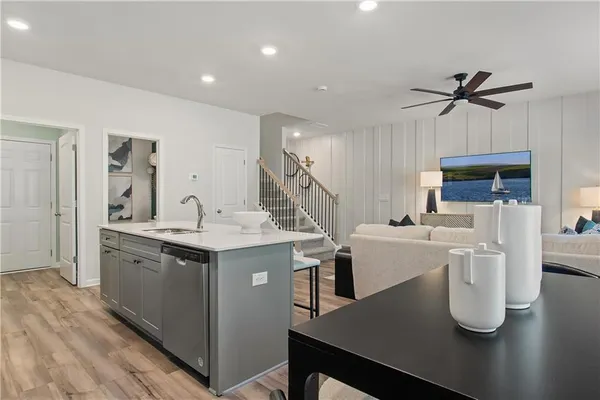 a kitchen with a sink a stove and refrigerator