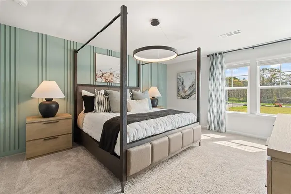 a bed room with a bed and a large window