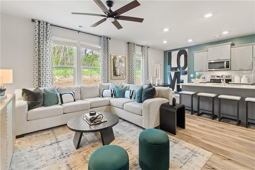631 Treasure Drive Stockbridge, GA 30281 - Photo 6 of 33 a living room with furniture and a large window
