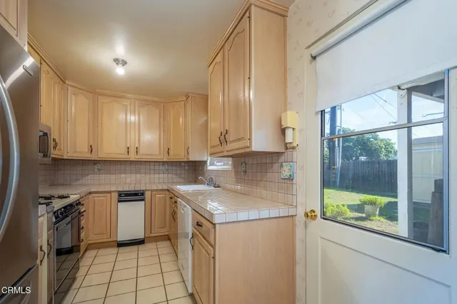 a kitchen with a stove and a microwave