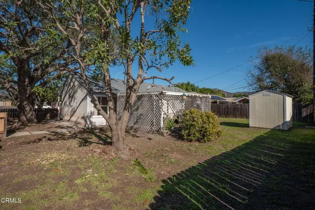a front view of house with yard outdoor seating and barbeque oven