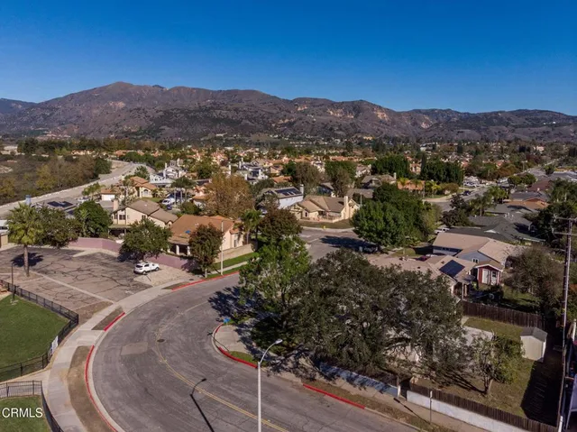 a view of a town with mountains in the background