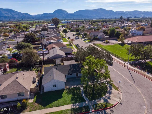 an aerial view of residential houses and outdoor space