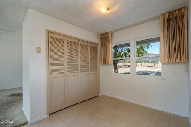 a kitchen with a sink a counter top space cabinets and stainless steel appliances