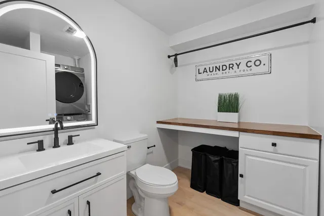a view of a hallway with washer and dryer