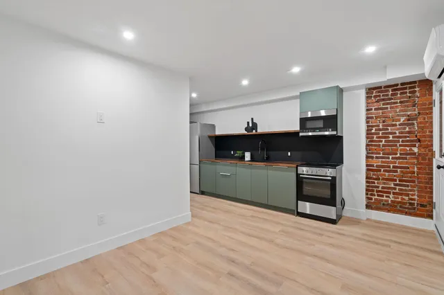a view of kitchen with wooden floor