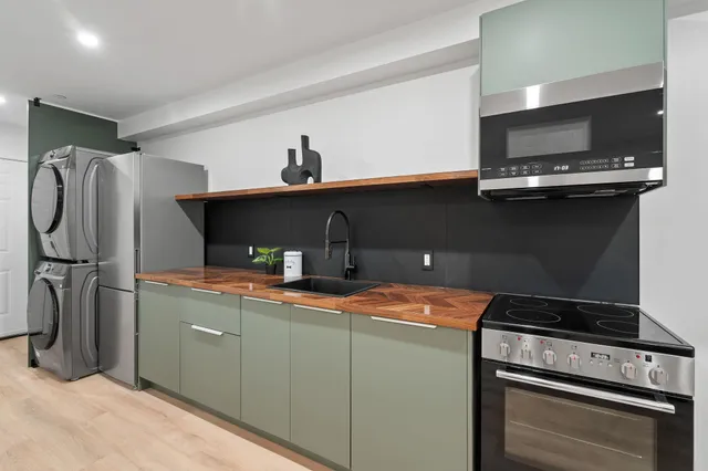 a kitchen with a stove and a refrigerator