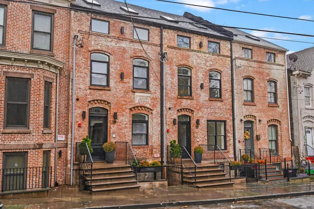 a front view of a multi story residential apartment building