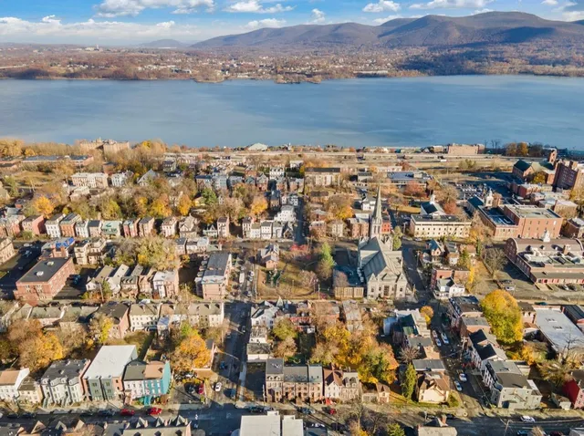 an aerial view of residential houses with buildings