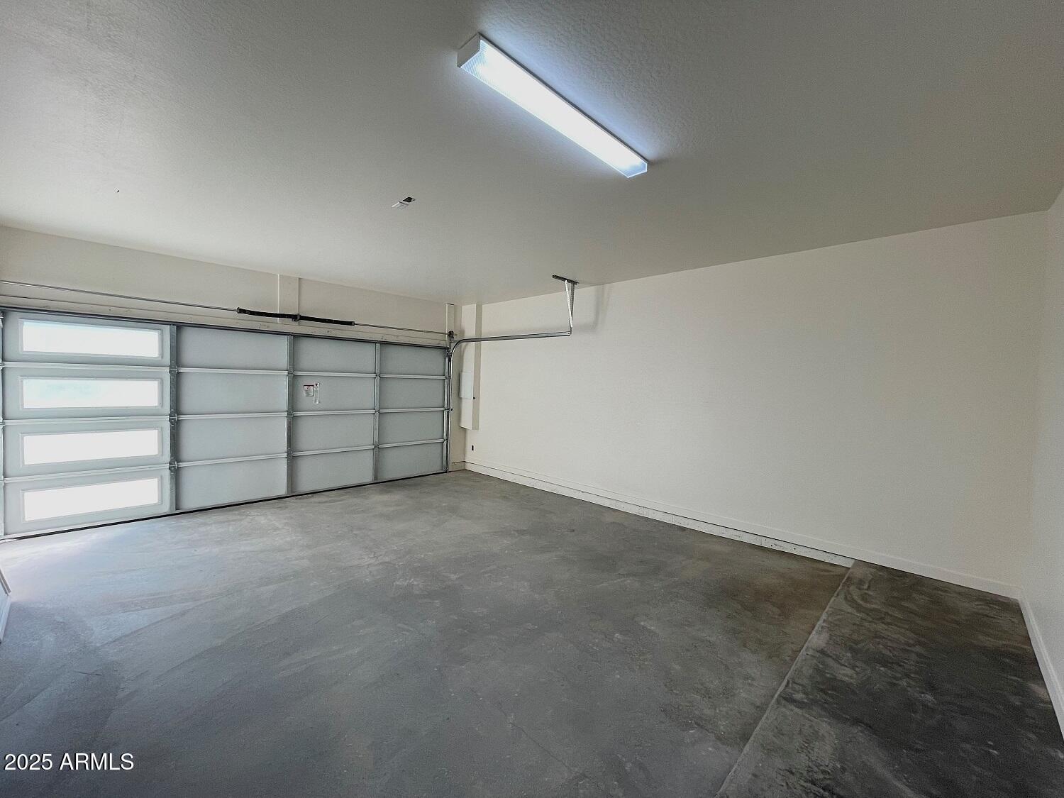 701 North McQueen Road, Unit 12 Chandler, AZ 85225 - Photo 12 of 15 a view of an empty garage