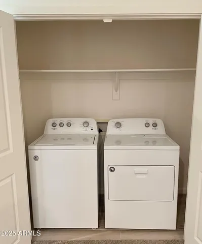 a kitchen with granite countertop a sink a stove and cabinets