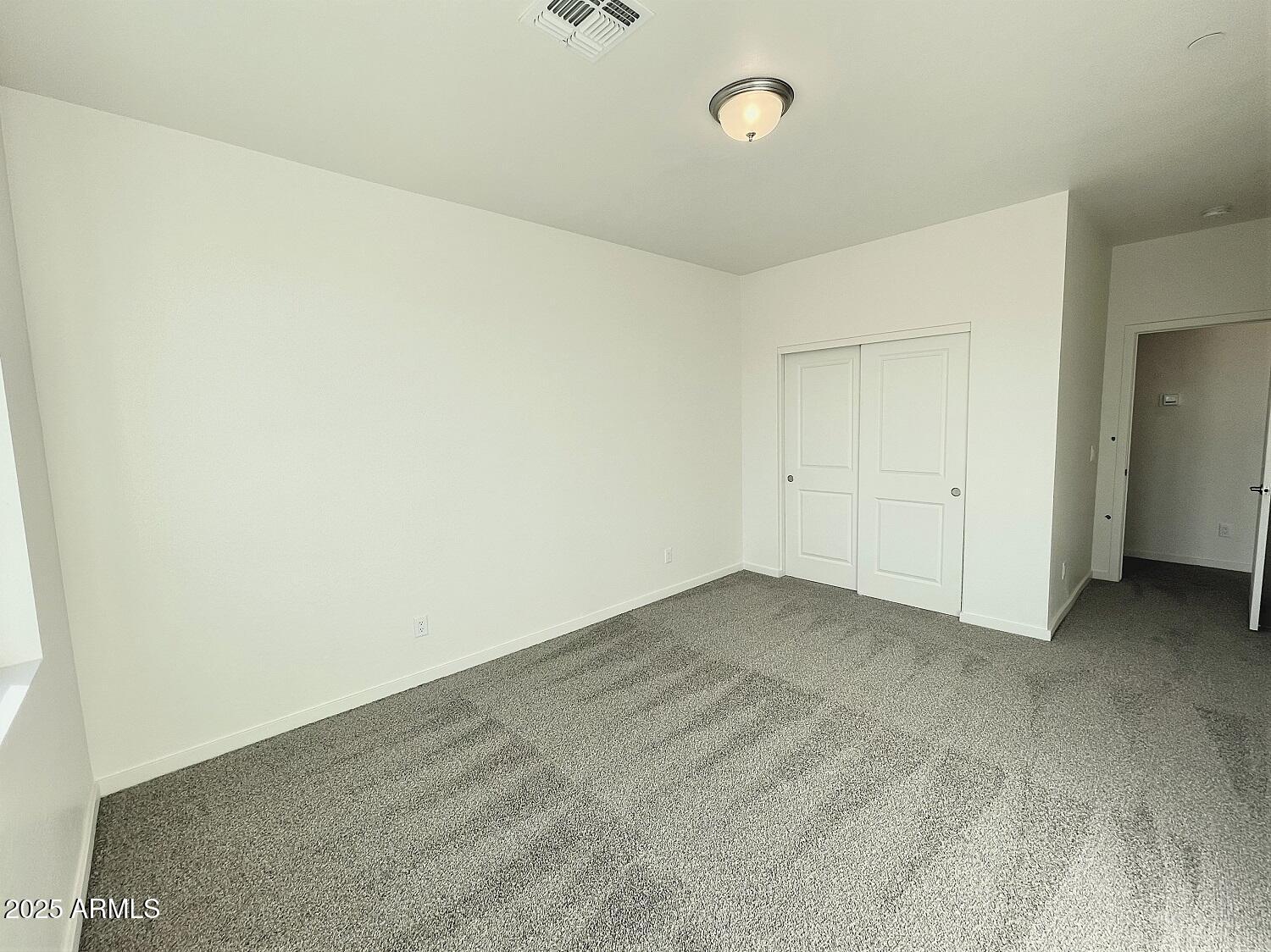 701 North McQueen Road, Unit 12 Chandler, AZ 85225 - Photo 6 of 15 an empty room with an entryway