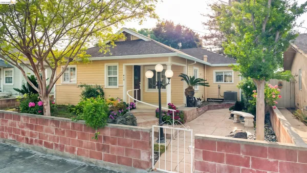 a front view of a house with garden