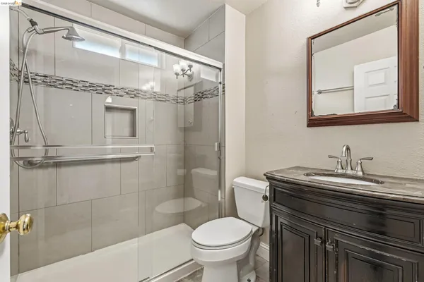 a view of room with window and ceiling fan