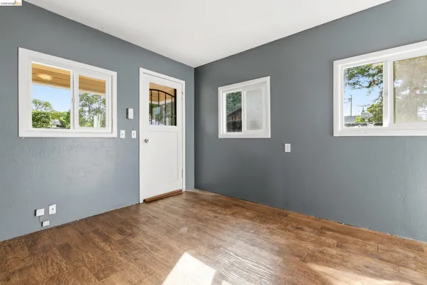 a view of empty room with closet and window
