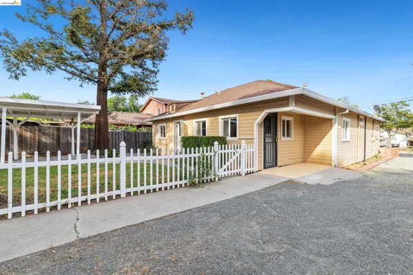 an aerial view of a house with outdoor space